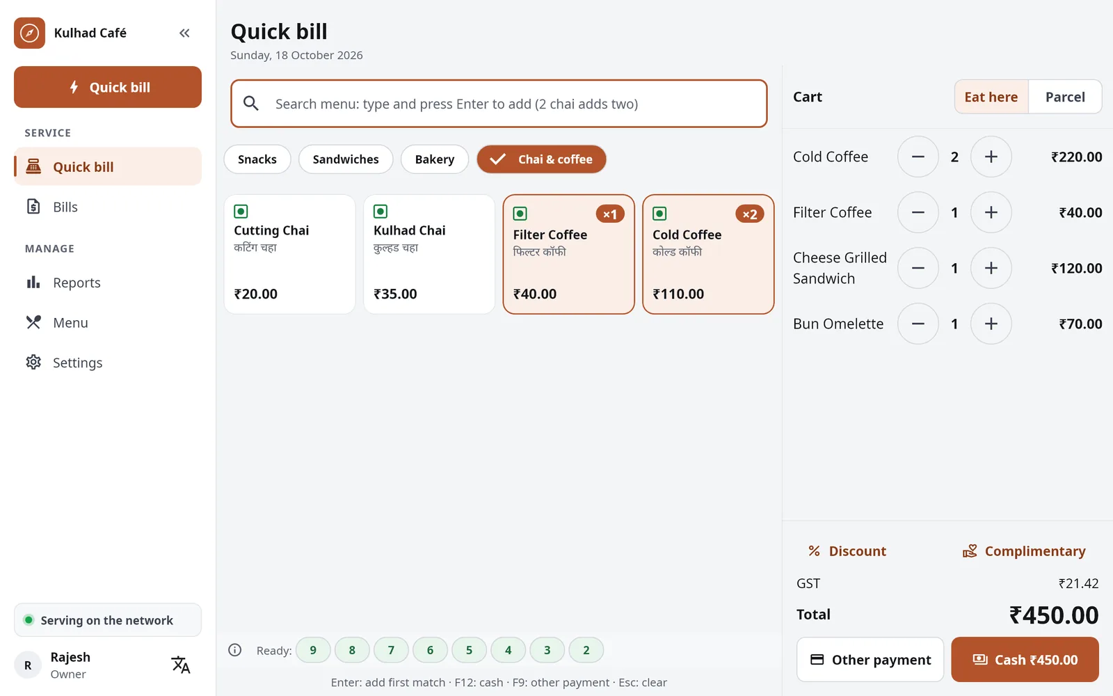 RestroCompass POS on an Android tablet at a café counter: a quick bill with cold coffees, a filter coffee, a cheese grilled sandwich and a bun omelette, and the ready token numbers.